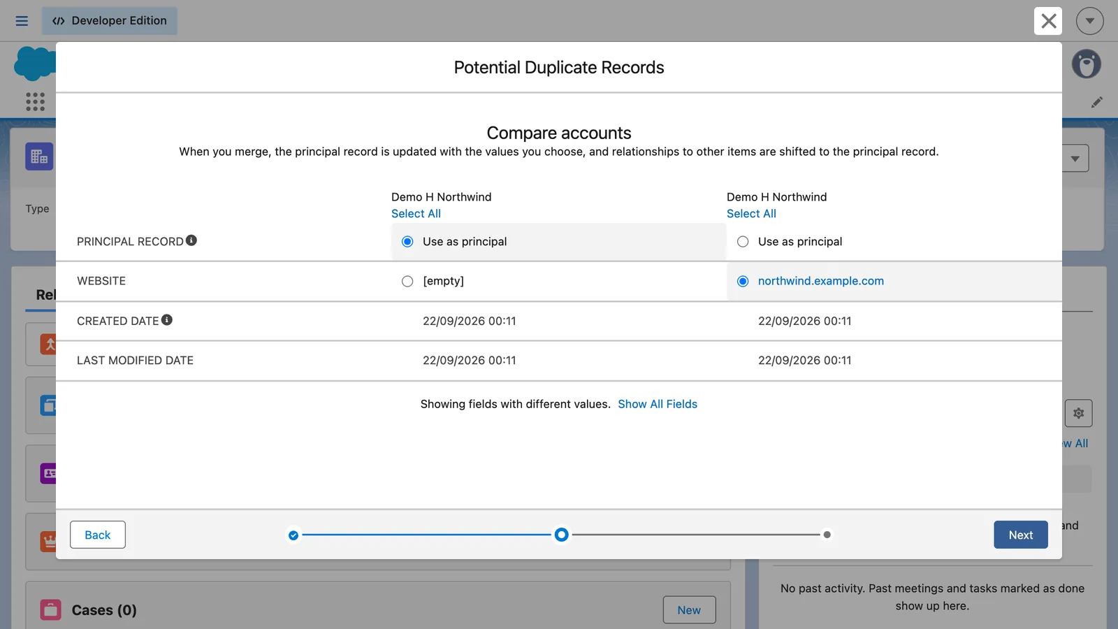 Salesforce screen from the video: Choose the principal record and the value to keep for each field that differs, then click Next.